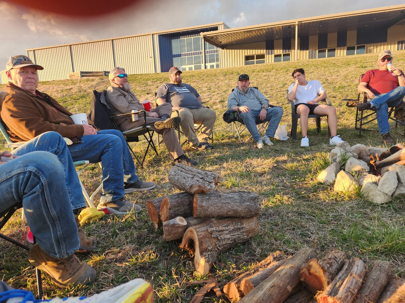 Men sharing stories at a CV Men fire