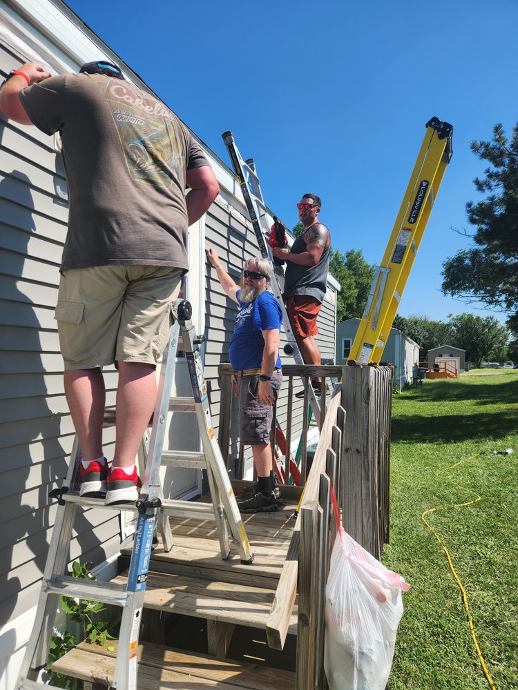 Men working together on a home service project